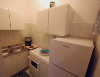 wall, indoor, sink, countertop, bathroom, home appliance, cabinetry, plumbing fixture, tap, drawer